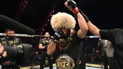 UFC 254 GALLERY: Dagestan fighter Khabib Nurmagomedov celebrates his victory over Justin Gaethje of the US after their lightweight title bout on UFC Fight Island in Abu Dhabi. Getty