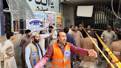 Rescue workers carry out operations following the explosion. EPA