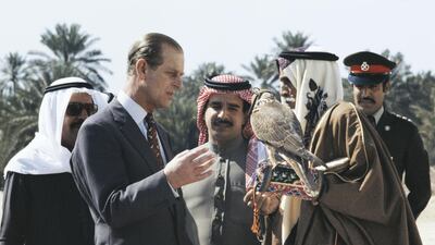 Prince Philip looks at a hawk during a visit to Manama, Bahrain, in 1979. Getty Images