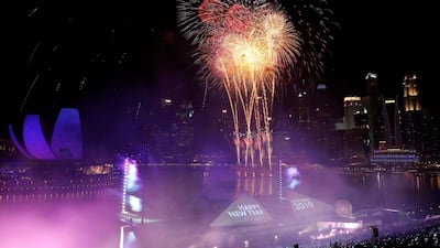 Fireworks explode over the Marina Bay for the New Year celebrations in Singapore. Reuters