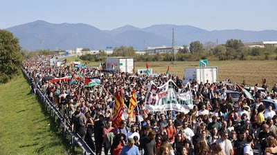A protest march along a motorway slip road near Pisa. EPA