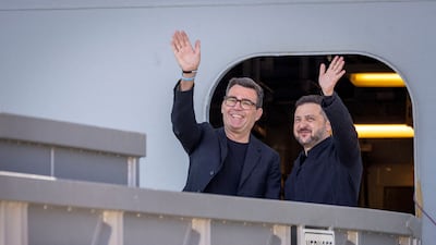 British Prime Minister Andy Burnham and President of Ukraine, Volodymyr Zelenskyy, wave on board the HMS Queen Elizabeth aircraft carrier. Reuters