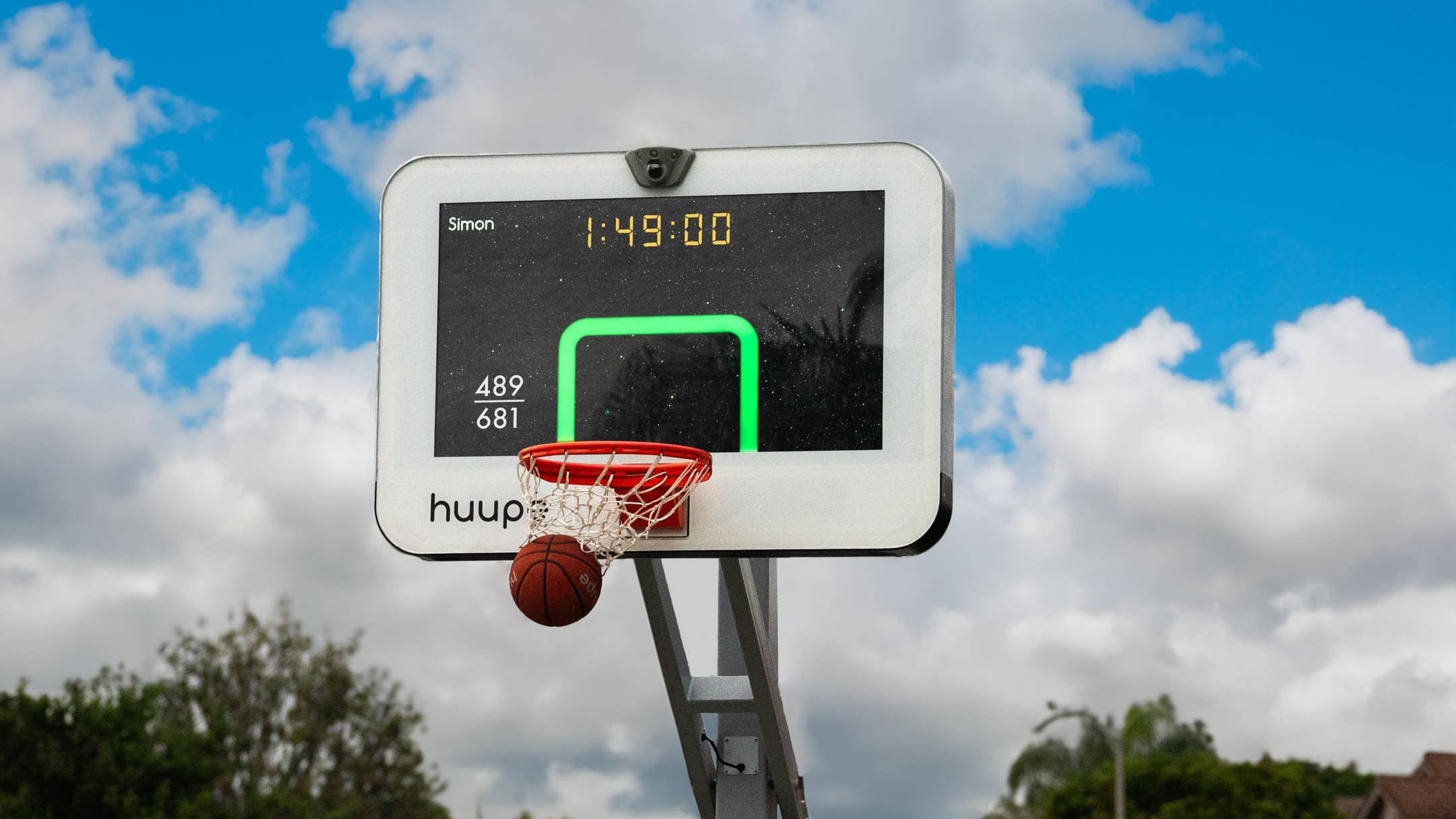 The Huupe is a full-size, smart basketball hoop that uses AI to track performance, and play against other players around the world. Photo: Huupe