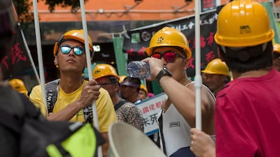 Activists from the construction industry take part in the annual Labor Day march in Hong Kong. EPA