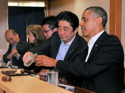 Japanese Prime Minister Shinzo Abe and U.S. President Barack Obama have dinner at the Sukiyabashi Jiro sushi restaurant in Tokyo, in this picture taken April 23, 2014, and released by Japan's Cabinet Public Relations Office. Cabinet Public Relations Office/Handout via Reuters/JAPAN OUT.