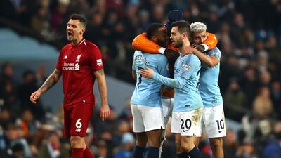 Benjamin Mendy of Manchester City celebrates victory with Raheem Sterling. Getty Images