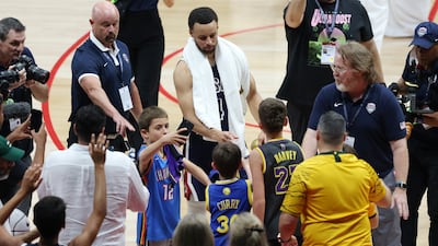 Stephen Curry of USA signs autographs after the game. Team USA play two warmup matches in Abu Dhabi as part of their 2024 Paris Olympics preparations, with Serbia up next.