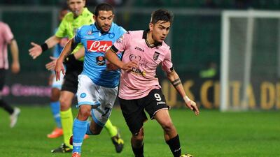Pablo Dybala, right, is wanted by Napoli, but Palermo's president does not believe the Italian club can afford him. Mike Palazzotto / EPA
