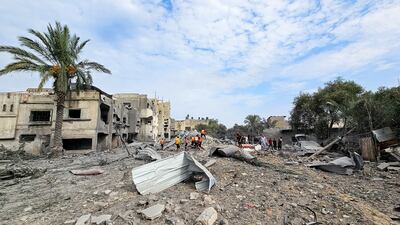 Palestinians gather at the site on an Israeli air strike in the north of the Gaza Strip. Reuters