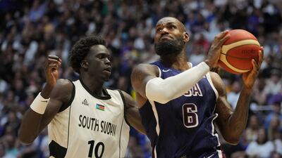 United States' forward LeBron James, right, goes for the basket as South Sudan's forward JT Thor defends during an exhibition basketball game between the United States and South Sudan, at the o2 Arena in London, Saturday, July 20, 2024. (AP Photo / Kin Cheung)