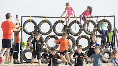 Kids compete and enjoy the obstacles and challenges on the Mini Mudder course.