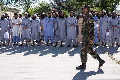 Taliban prisoners wait for their release at a government prison north of Kabul. 900 prisoners were released throughout Afghanistan on Tuesday, the last day of the Islamic festival of Eid Al Fitr and the last day of the three-day ceasefire. Stefanie Glinski for The National