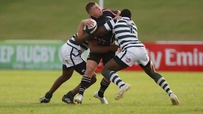 Ross Combe, centre, enjoyed his debut for the UAE in the Cup of Nations. Mike Young / The National