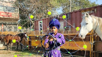 Sartaj Singh, 15, a young Nihang Sikh warrior, practises martial arts at the Singhu border, some 15 km away from the Indian capital New Delhi, where hundreds of thousands of farmers have been camping since November 26, 2020. Taniya Dutta for The National