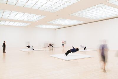 Visitors at the Museum of Contemporary Art (MOCA) in Los Angeles watch the performance In Just a Blink of an Eye by Xu Zhen. Myles Pettengill