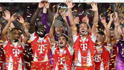 Bayern Munich's Luis Diaz, Harry Kane and others celebrate winning the German Super Cup against Stuttgart. AFP