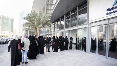 Women queue for security checks outside the National Career Exhibition at Sharjah Expo Centre. Reem Mohammed / The National