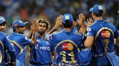 Lasith Malinga, third from left, took four wickets at Wankhede Stadium last night. Punit Paranjpe / AFP