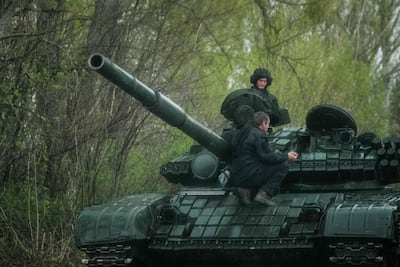 Ukrainian soldiers pictured on a tank near Lyman, eastern Ukraine. (Photo by Yasuyoshi CHIBA / AFP)