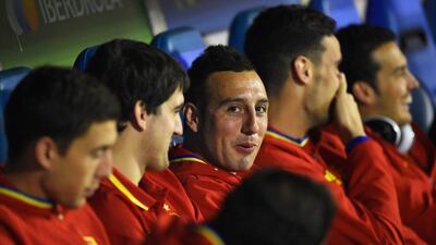 Santi Cazorla, who scored the second goal, watches from the bench at the start of the match. Mike Hewitt / Getty Images