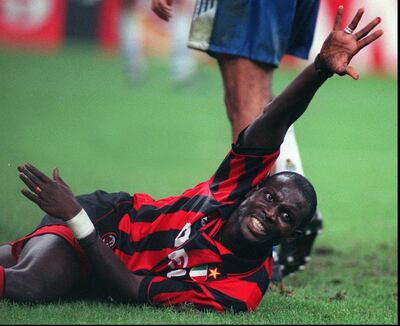 Then AC Milan striker George Weah cries for help after injuring his left hand during a match in Milan on September 11, 1996. Carlo Fumagalli, File / AP