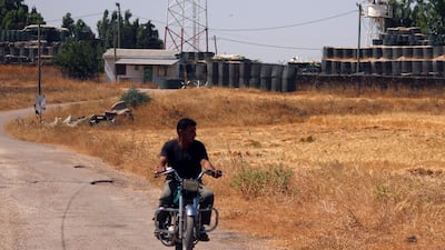 A man drives a motorcycle near the UN disengagement observer force checkpoint in Quneitra, Syria on July 10, 2017. Alaa Al Faqir / Reuters