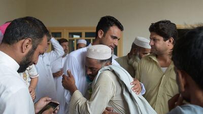 Fakhar Zaman meets with local residents and cricket fans during a visit to his village following Pakistan's triumphant Champions Trophy campaign. Aamir Qureshi / AFP