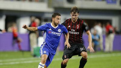 Chelsea forward Eden Hazard in action with AC Milan’s Andrea Poli. Eric Miller / Reuters