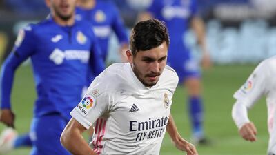 Real Madrid defender Victor Chust runs with the ball. EPA