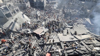 People search for survivors amid the rubble of buildings destroyed during Israeli bombardment, in Khan Yunis in the southern Gaza Strip. AFP