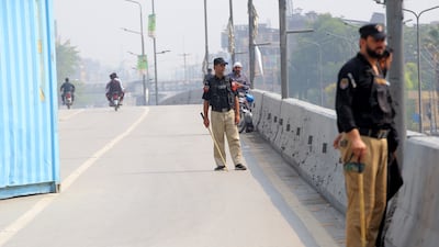 Pakistani security forces stand guard at roadblocks in Peshawar. EPA