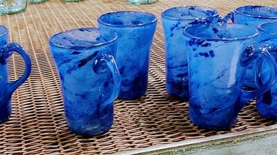 The shattered glass collected from the blast-affected areas in Beirut is being transformed into jugs, water bottles and coffee mugs. Courtesy Ziad Abi Chaker