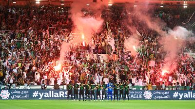 Al Ahli players celebrate with the fans inside Prince Mohamed bin Fahd Stadium. Getty