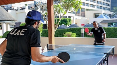 UAE Special Olympics table tennis athlete Mohammed Almas (R) trains in Al Ain ahead of the regional games.Victor Besa / The National