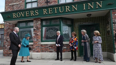 Actors wait to meet Queen Elizabeth during a visit to the set of the long-running television series 'Coronation Street' in July in Manchester.