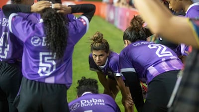 Al Maha players in a huddle during a break.
