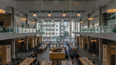 The soaring atrium is now filled with neat rows of desks, overlooked by glass walkways. Courtesy Lebanese National Library