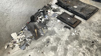 A flat screen TV is just one of the items that got smashed. Chris Whiteoak / The National