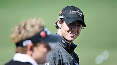 Rory McIlroy blasts his out of the bunker on the 18th hole in Hong Kong.