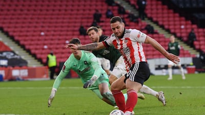 Billy Sharp rounds Plymouth goalkeeper Michael Cooper before scoring. Getty