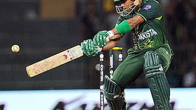 Umar Akmal cuts his way to an important 44 not out as Pakistan survived a few tense moments in their run chase. William West / AFP