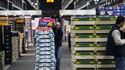 A customer moves a barrow with fruit to his truck from the fruits and vegetables hall at Rungis international wholesale food market near Paris. Etienne Laurent / EPA