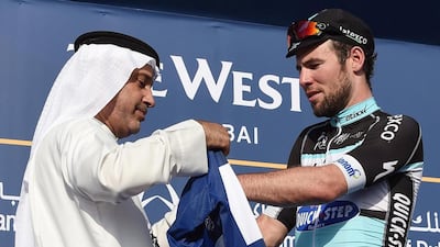 Briitish Mark Cavendish (R) of Etdox Quick Step team celebrates winning the first stage of the 2015 Dubai Tour in Dubai on 04 February 2015. EPA/DANIEL DAL ZENNARO