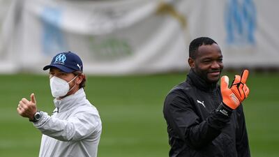 Andre Villas Boas and Steve Mandanda. AFP