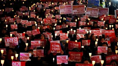Koreans at a protest in central Seoul calling for president Park Geun-hye to step down. Kim Hong-ji / Reuters