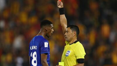 Al Hilal's Mohamed Kanno is shown a red card by referee Roberto Tobar. Reuters