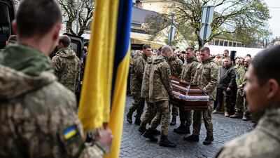 Colleagues bid farewell to Yuriy Dadak-Ruf and Taras Kryt, the Ukrainian soldiers killed in Russian shelling of the Luhansk region. Reuters