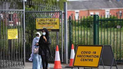 People leave a vaccination centre set up at the Masjid-e-Saliheen mosque in Blackburn. AFP