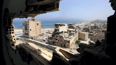 Destroyed buildings are seen through a hole in Benghazi lighthouse after it was severely damaged by years of armed conflict in 2019. Reuters