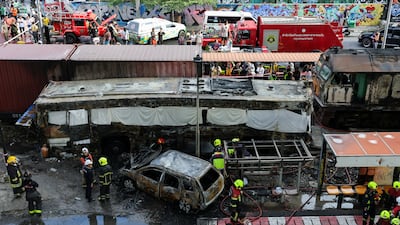 Emergency services attend Bangkok's Makkasan Airport Rail station, where a train collided with a bus, several cars and motorcycles. Reuters